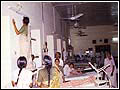 Women cleaning hospital under Village Development program