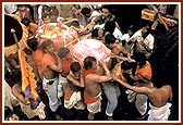 The murti of Lord Jagannath is carried for installation in the Rath 