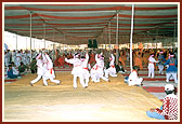 During Swamishri's morning puja, a total of 360 children from 31 different villages performed a 'maha-raas' - traditional dance around the audience and on stage