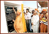 Ceremonial unveiling of village name plaque