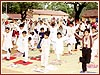 Children and youths receive training on how to perform their personal morning puja