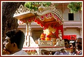 Shri Harikrishna Maharaj being carried in a palanquin by devotees