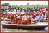 Swamishri with Thakorji and Ganeshji during the ritual five time circumambulatory boat ride in river Utavali 