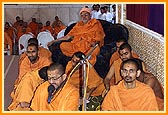 Bhajans being sung by sadhus during puja