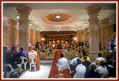 Swamishri and devotees engaged in the murti-pratishtha rituals