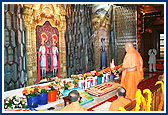 To commemorate the 100th murti-pratishtha anniversary (patotsav) of Bochasan Mandir Swamishri first performs arti of the murtis of Bochasan Mandir depicted on a curtain