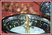 Panchamrut Snanam offered to Harikrishna Maharaj during Mahapooja ceremony