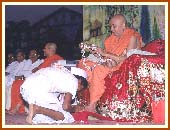 The first satsangi tribal graduate being garlanded by Swamishri, Dharampur, 4 May 1999