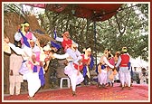 Colorfully dressed tribal youths enthusiastically perform the local Dangi dance