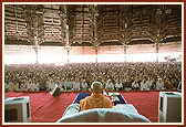 Swamishri performing morning puja in the mandir assembly hall