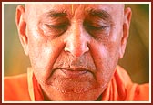 Swamishri engaged in the murti of Harikrishna Maharaj during puja