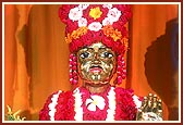 Shriji Maharaj adorned with flowers