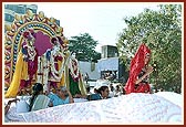 Shri Harikrishna Maharaj and Shri Radha Krishna Dev in a decorated float