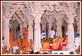  After arriving and having Thakorji's darshan, Swamishri blesses the assembly arranged on the mandir podium 