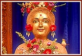 Beautifully adorned murti of Shri Harikrishna Maharaj in chandan