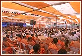 Devotees seated in the murti pratishtha assembly