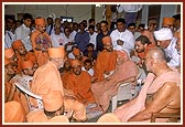Swamishri meets and pays respects to the resident sadhus at the Gurukul