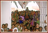 Women devotees seated in the murti pratishtha ceremony
