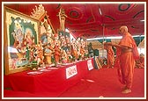 Swamishri performs the murti-pratishtha arti of murtis for Hari mandirs in the suburbs of Amdavad, namely, Bopal, Ghatlodia and Narayanpura, Sola Road, and Saraspur