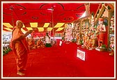 Swamishri performs the murti-pratishtha arti of murtis for Hari mandirs in the suburbs of Amdavad, namely, Bopal, Ghatlodia and Narayanpura, Sola Road, and Saraspur