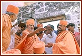 Swamishri on an observation tour around the village mandir