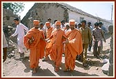 Swamishri on an observation tour around the village mandir