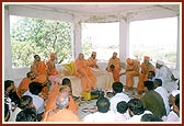 Swamishri blesses a satsang assembly in the mandir