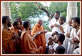 Swamishri talks to parshads in the mandir pradakshina