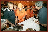 Swamishri views the certificate printing area