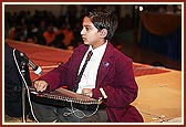 A student plays the swarmandal