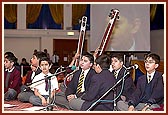 Students play and sing with great devotion and proficiency