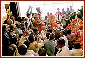 Before departure Swamishri is seated amongst devotees at Terminal 3