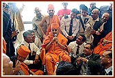 Swamishri gives his blessings to those gathered at the airport