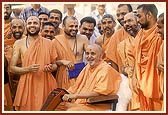 In a jovial mood with sadhus and devotees 