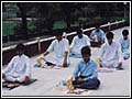 Devotees performing morning puja