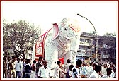A decorative moving elephant made of papier mache became an attraction for spectators