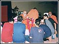 Swamishri chooses a balak by garlanding him