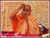 Performing tilak chandlo and chanting the name of Swaminarayan during his morning puja