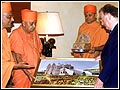 Swamishri presents a photo - momento of the Shree Swaminarayan Mandir, London, to the President