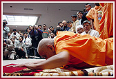 Swamishri prostrates to the newly-inaugurated murtis