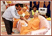 Pujya Doctor Swami presents an auspicious kalashes