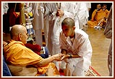 Swamishri blesses and presents a memento to all the kishores 