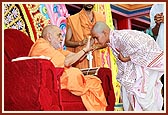Swamishri blesses one of the young children who took part in the janoi ceremony