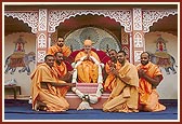 The residing sadhus of Jaipur mandir offer a garland to Swamishri
