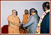 Swamishri greets Minister of Food, Mr. Kariyuki