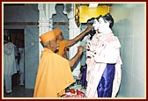 Pujya Doctor Swami and Bhaktavatsal Swami perform the murti-pratishtha rituals at BAPS Shri Swaminarayan Mandir, Mwanza