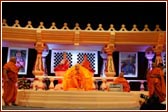 Ghanshyamcharan Swami and Krishnapriya Swami make Swamishri and the audience laugh