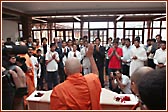 Swamishri raises his hand in blessing to children who pledged not to watch films or TV