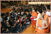 Swamishri showers the final year students with flowers