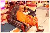 A young child shows his love for Swamishri